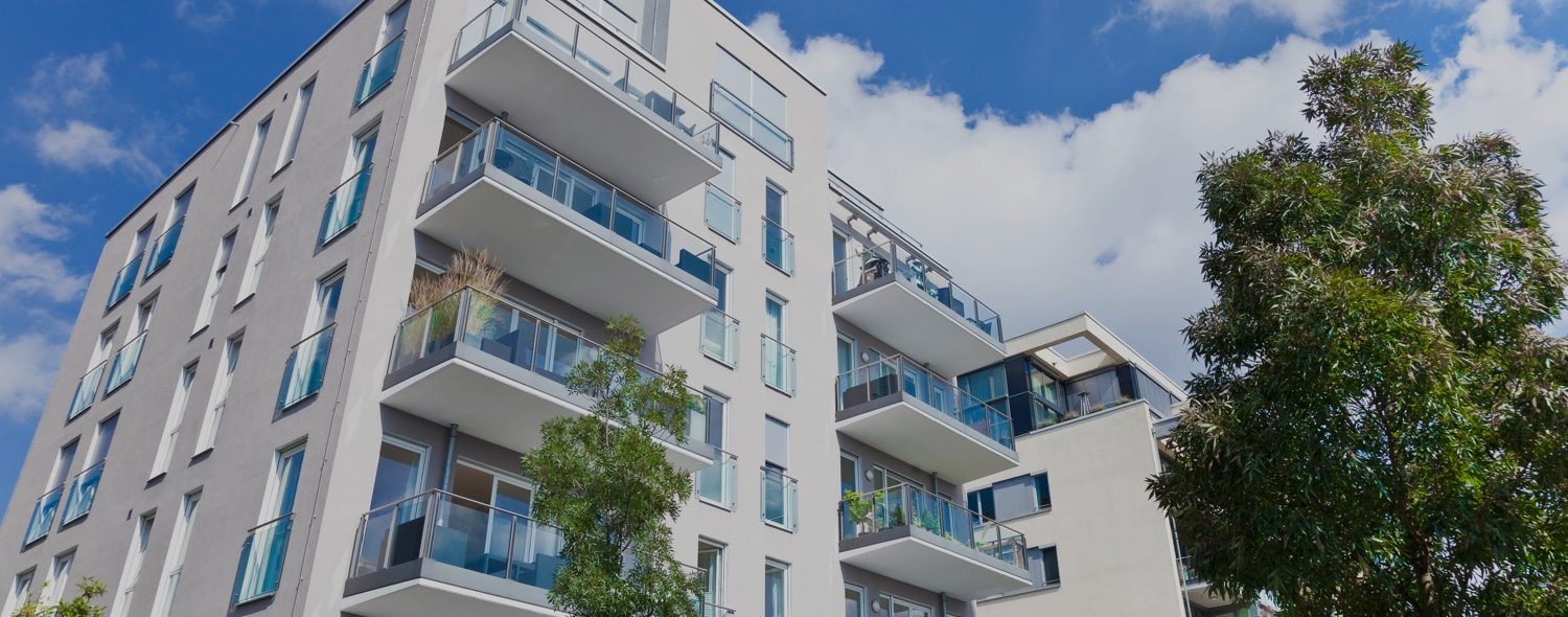 View of a white residential condominium building